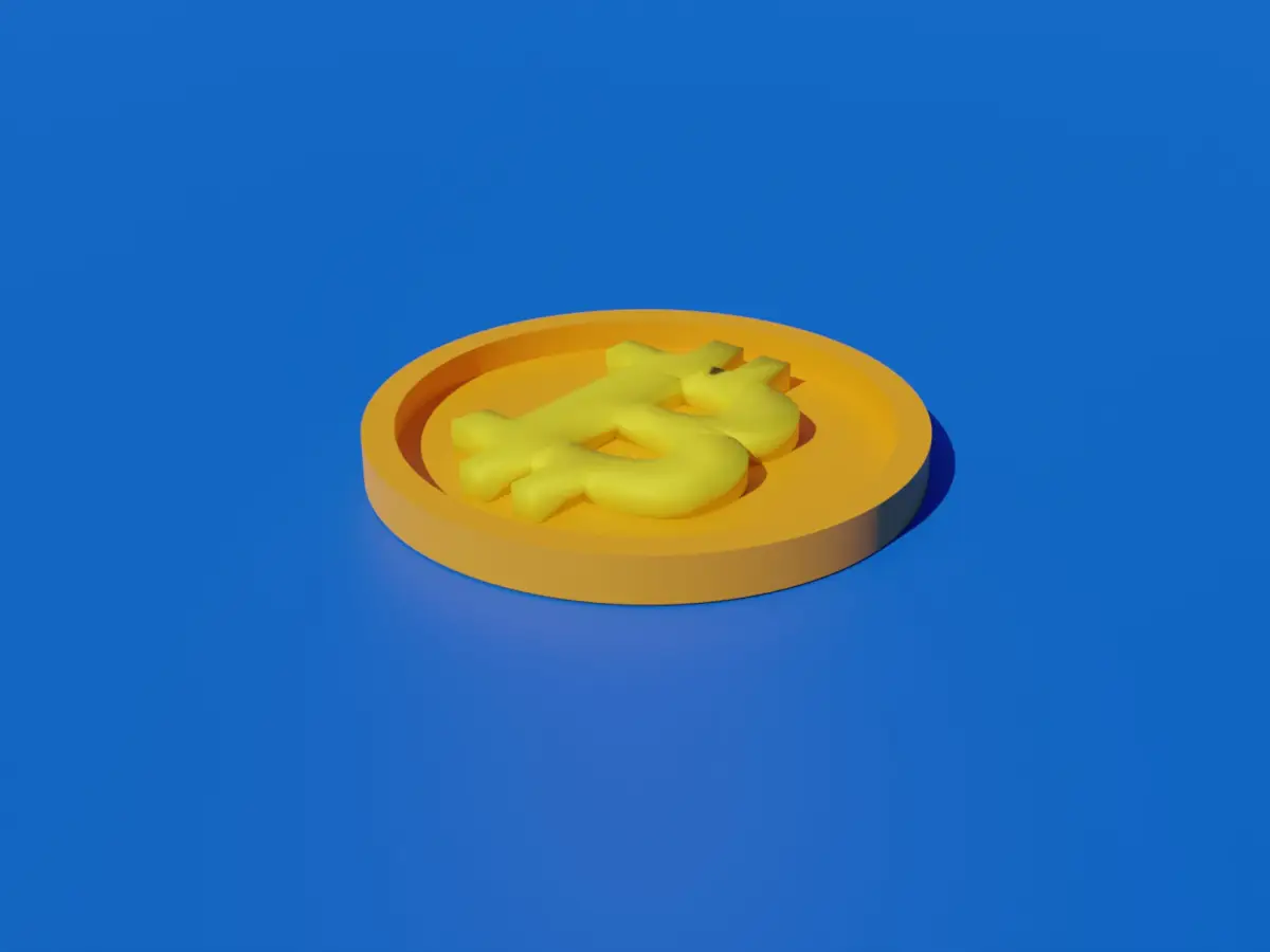 a yellow plastic object sitting on top of a blue surface